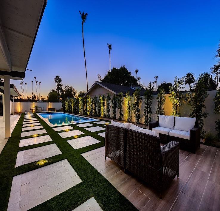 A modern backyard pool at twilight A modern backyard pool at twilight